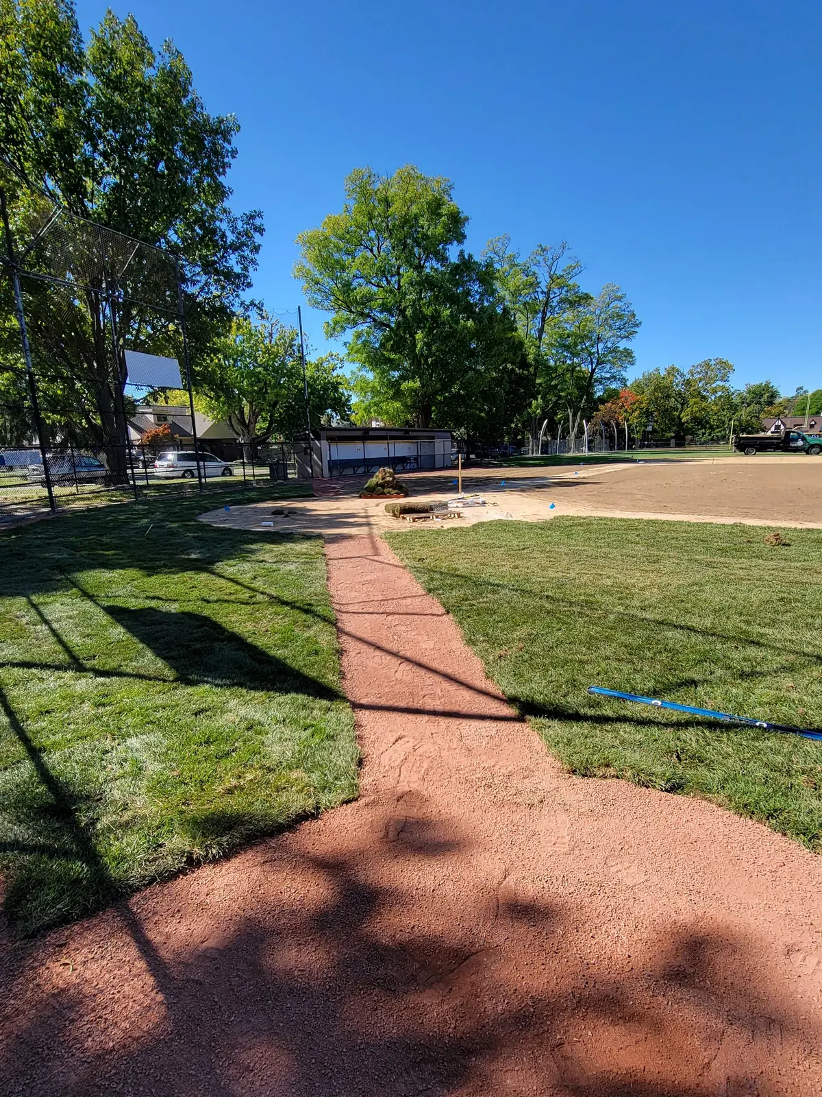 Edged baseline running toward the outfield on a renovated diamond, serving West Chester, OH