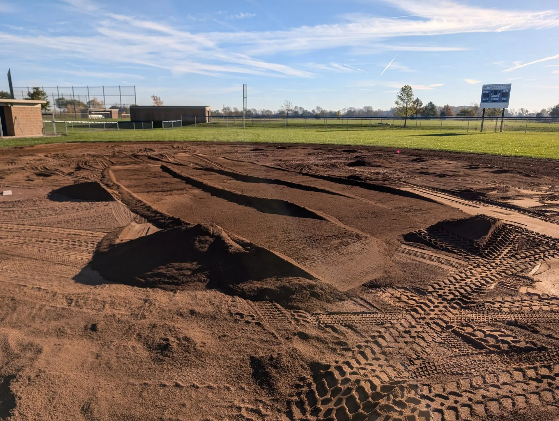 Infield mix spread across a baseball infield at the start of a renovation