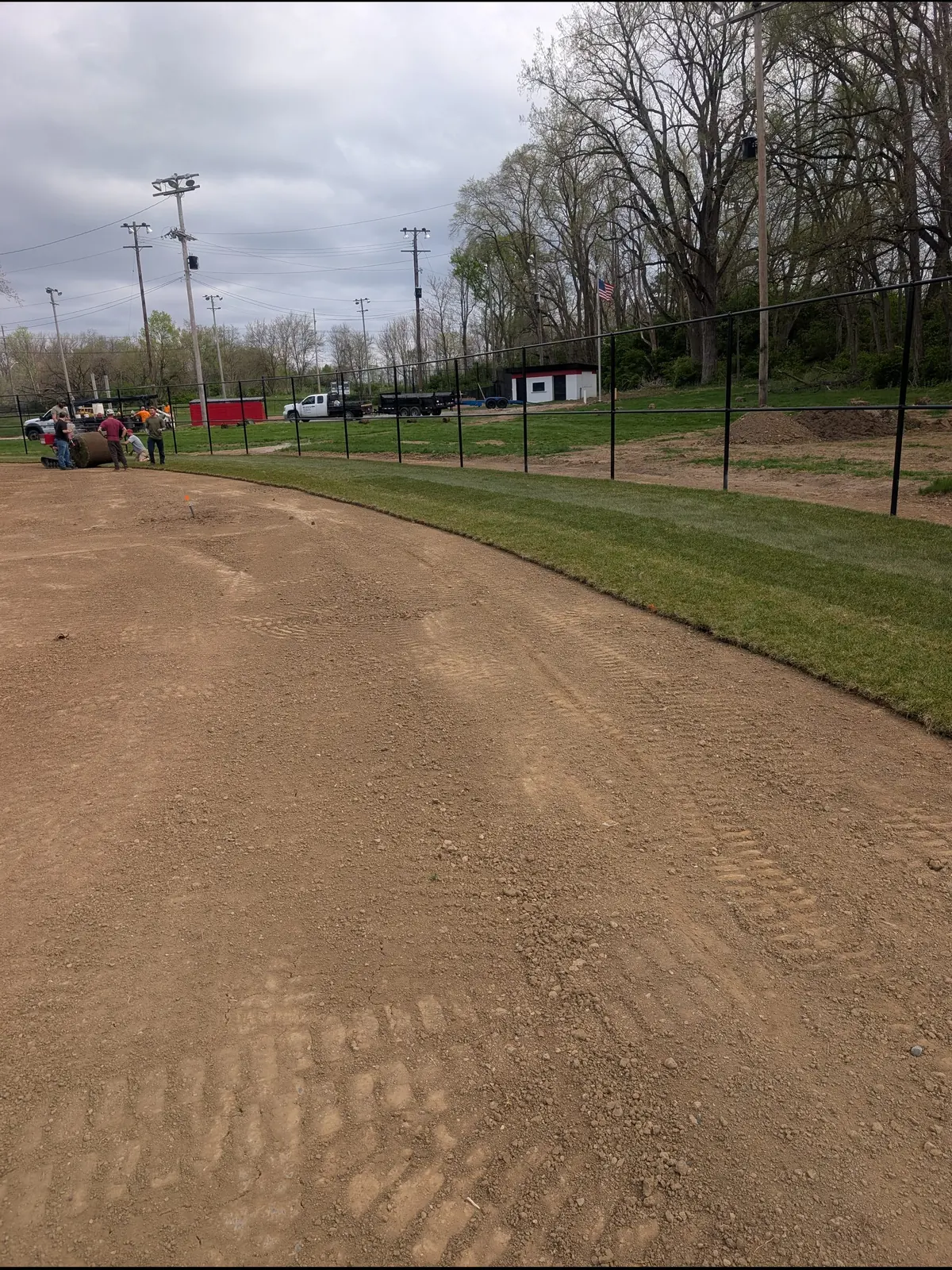 Infield skin graded smooth with a fresh edge along the grass, serving Dayton, OH