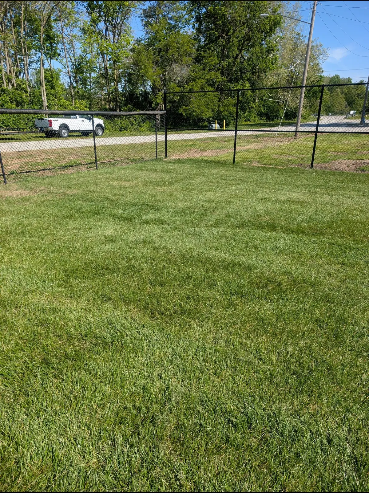Level natural grass field ready for play, serving Kettering, OH